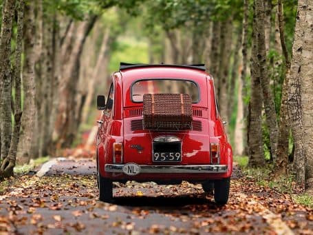 Vintage vehicle in a scenic landscape